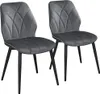 Two dark gray upholstered dining chairs with black metal legs are shown against a white background.