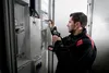 An electrician is working on an electrical panel. Anteprima dell’immagine prodotto