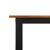 A close-up view of the corner of a wooden tabletop supported by a black U-shaped leg. Podgląd zdjęcia produktu