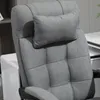 A close-up view of the headrest and upper backrest of a gray office chair. Náhled obrázku produktu