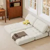 A beige modular sofa is arranged on a carpeted floor in a room with two windows and a wooden cabinet. Produktbild-Vorschau