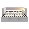 A light gray sofa bed with its mattress slats extended, showing the pull-out bed mechanism. Voir les images du produit