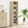 A tall, narrow wooden cabinet with shelves, next to a larger cabinet and a potted plant. Voir les images du produit