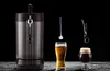 A beer dispenser with two glasses of beer and accessories against a black background. Voir les images du produit