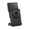 A black compact camera with its screen flipped up, shown against a white background. Podgląd zdjęcia produktu
