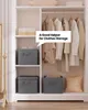 A closet with shelves and hanging clothes, featuring storage boxes. Produktbild-Vorschau