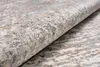 A close-up view of a rolled-up rug with a textured pattern. Anteprima dell’immagine prodotto