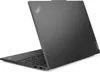 A gray Lenovo ThinkPad laptop, viewed from a diagonal angle, showing the lid and part of the keyboard. Produktbild-Vorschau