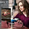 A woman is using a phone case with a kickstand feature while reading a book. Produktbild-Vorschau