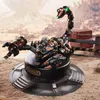 A steampunk-style mechanical scorpion model displayed on a circular platform. Náhled obrázku produktu