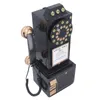 A vintage-style black rotary dial telephone ornament. Voir les images du produit