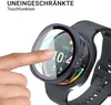 A finger is touching a smartwatch screen, which is covered by a protective case. The smartwatch is on a wrist with a dark strap. Produktbild-Vorschau