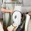 A person is putting a white projector into a backpack. Produktbild-Vorschau