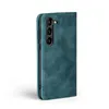 A teal flip cover case for a smartphone is shown against a white background. Produktbild-Vorschau