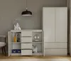 A modern living room setting with a kommode and a wardrobe. Podgląd zdjęcia produktu