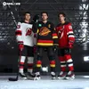Three hockey players in uniform standing on an ice rink. Produktbild-Vorschau