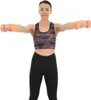 A woman is holding dumbbells and performing an exercise. Náhľad obrázku produktu