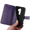 A hand holding a purple flip phone case. Produktbild-Vorschau