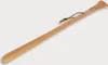A wooden shoehorn with a leather string attached to the handle. Produktbild-Vorschau