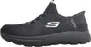 A black Skechers slip-on shoe is shown from the side against a white background. Voir les images du produit