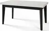 A modern dining table with a white marble-effect top and black legs, shown from a slight angle against a white background.