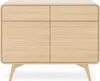 A light wood dresser with rounded edges and four doors, standing on four tapered legs. Produktbild-Vorschau