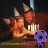 A family celebrating a birthday with a cake and candles, with a soccer ball-shaped lamp in the foreground. Produktbild-Vorschau