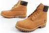 A pair of tan Timberland boots on a white background. Produktbild-Vorschau