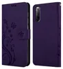 A purple flip case for a Sony Xperia 10 II phone, shown open and closed, with a floral design. Náhled obrázku produktu