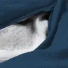 A close-up view of the zipper and interior mesh lining of a blue bean bag. Voir les images du produit