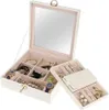 An open jewelry box with various compartments filled with jewelry and watches. Náhled obrázku produktu