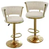 Two cream-colored bar stools with gold accents are shown against a white background. Voir les images du produit