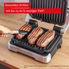 A hand using tongs to place steaks on an open electric grill. Produktbild-Vorschau