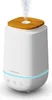 A white medisana aroma diffuser with a wooden top is shown against a white background, emitting a stream of vapor. Náhľad obrázku produktu