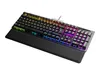 A gaming keyboard with RGB lighting and a wrist rest, shown from a diagonal angle on a white background. Produktbild-Vorschau