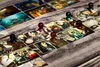 A close-up of a board game with cards and pawns on a wooden surface. Podgląd zdjęcia produktu