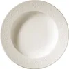 A top-down view of a white porcelain bowl with an embossed decorative rim. Produktbild-Vorschau