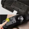 Close-up shots of a black LED headlamp with a finger pressing a yellow button. Náhled obrázku produktu