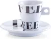 A white espresso cup and saucer with the word "COFFEE" printed on it in black letters. Anteprima dell’immagine prodotto