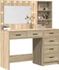 A vanity table with a mirror and shelves, displaying makeup and decorative items. Náhled obrázku produktu