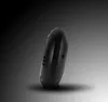 A black alarm clock is shown in profile against a gradient background. Produktbild-Vorschau