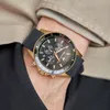 A close-up shot of a person's wrist wearing a gold and black Maserati watch, with part of their clothing visible. Produktbild-Vorschau