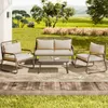 A patio furniture set is arranged on a rug on a wooden deck, with a grassy yard and trees in the background. Podgląd zdjęcia produktu