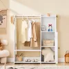 A child's wardrobe and shelving unit in a room with a rainbow tapestry on the wall. Anteprima dell’immagine prodotto