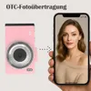 A pink digital camera is shown next to a smartphone displaying a portrait of a woman, illustrating photo transfer. Produktbild-Vorschau