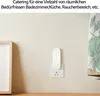A white air purifier plugged into a wall socket, with a curtain in the background. Produktbild-Vorschau