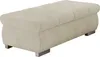 A studio shot of a beige upholstered ottoman on a white background.