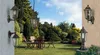 A garden scene with outdoor lighting fixtures. Produktbild-Vorschau