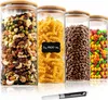 Four glass storage jars filled with different food items, placed on a white surface with a marker pen in the foreground. Produktbild-Vorschau