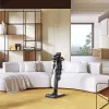 A modern living room with a white sectional sofa, a yellow rug, and a black stick vacuum cleaner. Anteprima dell’immagine prodotto